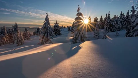 Sunset in wild snowy forest mountains frozen winter landscape nature Time lapse Stock Footage 148207954