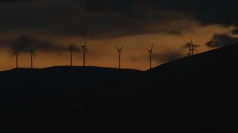 Sunset Wind Farm Hillside Stock Footage