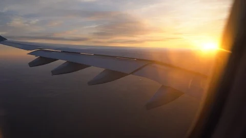 Sunset in the window of the plane. beautiful view of the aircraft wing Stock Footage 105430172