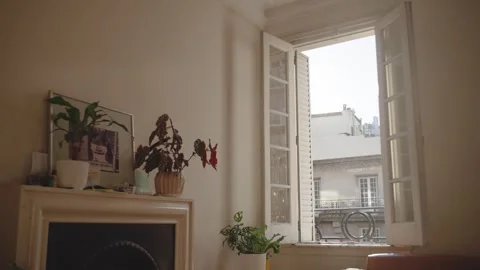 Sunset window with warm rays of light highlighting floating dust particles. Stock Footage 315007676