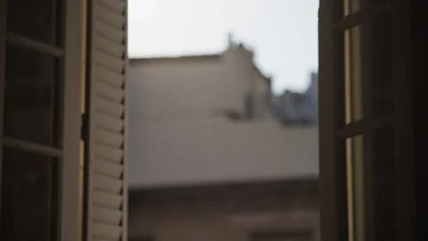 Sunset window with warm rays of light highlighting floating dust particles. Stock Footage 315007677