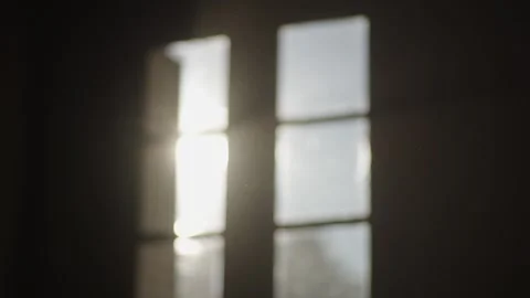 Sunset window with warm rays of light highlighting floating dust particles. Stock Footage 315007678