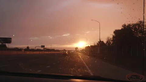 Sunset Windsheild Wipers During a Light Rain Stock Footage 132236291