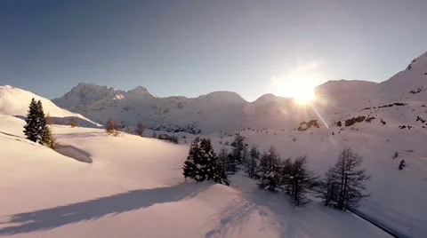 Sunset winter landscape. snow covered mountains. aerial view. fly over Stock Footage 37027778