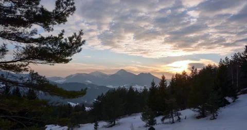 Sunset in the winter mountain landscape in the woods Video stock 171676892