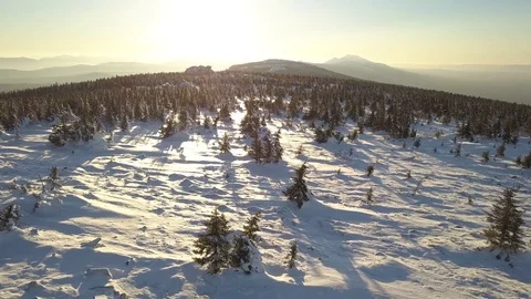 Sunset on the winter mountain ridge with trees aerial Stock Footage 84177817