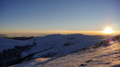 Sunset in the winter mountains landscape Stock Photos