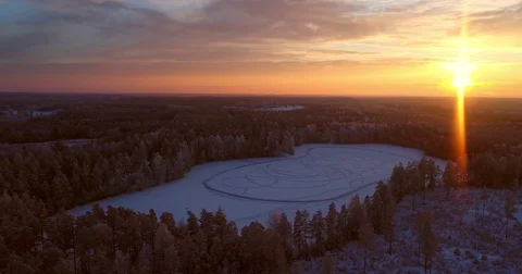Sunset at a winter pond, Cinema 4k aerial orbit view around a frozen pond, fu Stock Footage 85202999