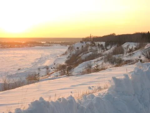 Sunset on winter river Stock Photos