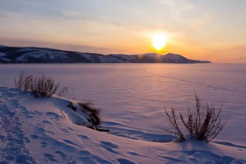 Sunset on the winter sea Stock Photos
