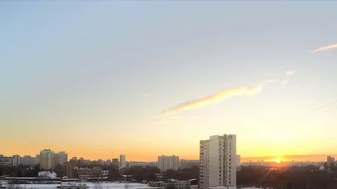 Sunset in winter sky in the town timelapse Stock Footage 79815605