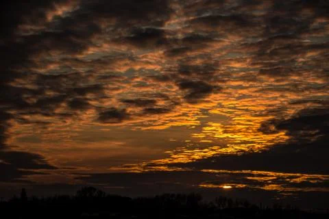 Sunset in the yellow-fire sky Stock Photos