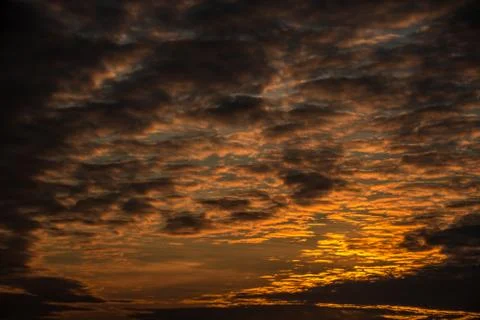 Sunset in the yellow-fire sky Stock Photos