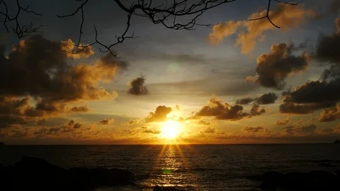 Sunset yellow gold beam light cloudy sky  into the sea with silhouette dry br Video stock 95654277