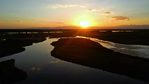 The sunset, the Yellow River meanders, the wetlands, lakes and reeds Stock Footage 257990633