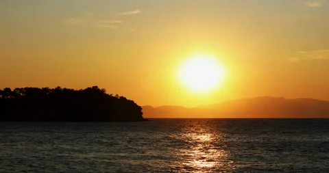 Sunset in the Yellow Sky. Big bright Yellow sun moves down. Stock Footage 234099516