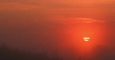 Sunset in the Yellow Sky. Timelapse. Big bright Yellow sun moves down. Stock Footage 157025003