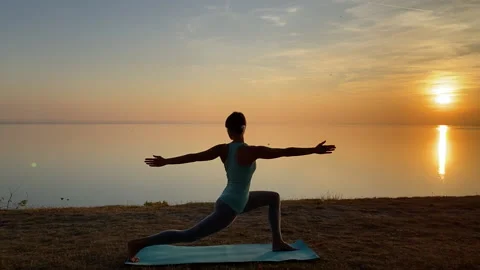 Sunset yoga exercise Stock Footage