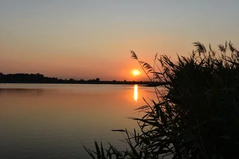 Sunset at Zobnatica lake Stock Photos