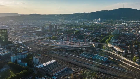 Sunset zurich river train station aerial view 4k timelapse switzerland Vídeo Stock 135765030