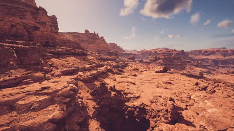 Sunsethued canyon with sandstone formations for Mars rover testing Stock Footage 331400522