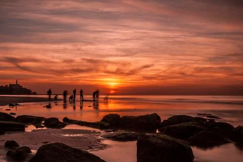 Sunsets, clouds people and the sea Foto stock