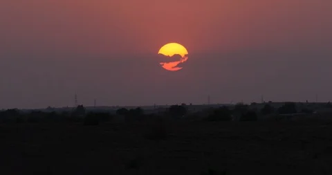 Sunsets through clouds in Rajasthan India Stock Footage 121135356