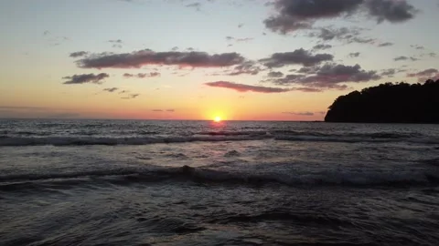 SunsetSurfFlyIntoTheSun Stock Footage 177587921