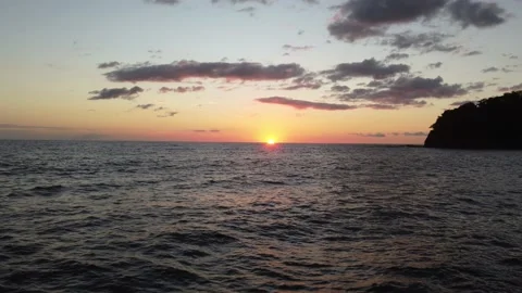 SunsetSurfIntoTheSunLandRight Stock Footage 177588542