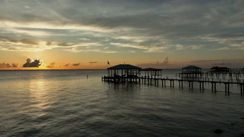 Sunsetting behind the clouds over Mobile Bay, Alabama Stock Footage 218380372