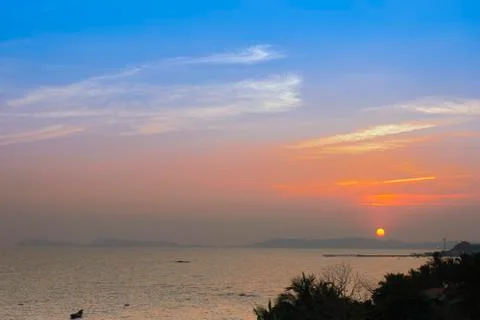 Sunsetting with rays of golden light on the sky Stock Photos