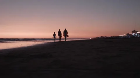 Sunsetwalkingonthebeach Stock Footage 132285301