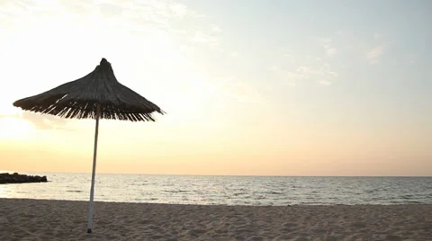 Sunshade on the beach in sunset Stock Footage 28293614