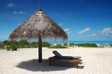 Sunshade with deckchair Stock Photos