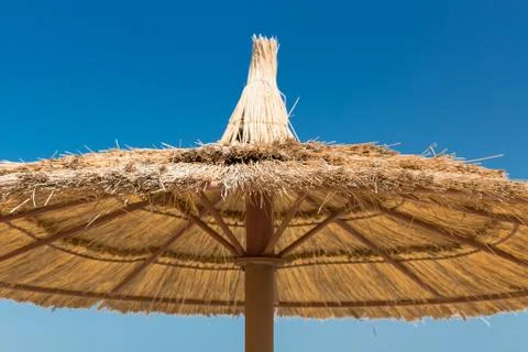 Sunshade umbrellas on the beach Stock Photos