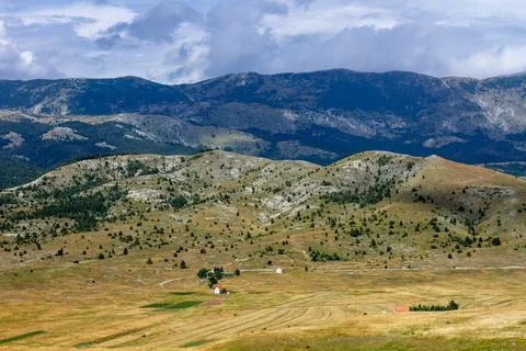 Sunshine and clouds in mountains Stock Photos