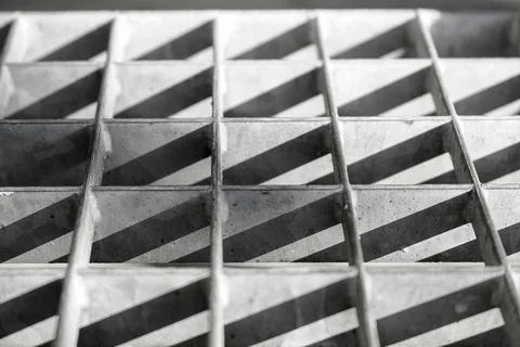 Sunshine casting a shadow pattern on a brick wall 스톡 사진