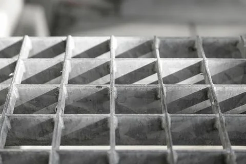 Sunshine casting a shadow pattern on a brick wall Stock Photos