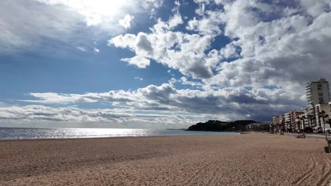 Sunshine in the cloudy stormy sky on an empty spanish beach, amazing view, 4K Stock Footage 273171693