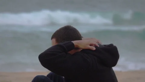 Sunshine Coast, Young Man Sit on the Beach, Thinking, slow motion Stock Footage 70891506
