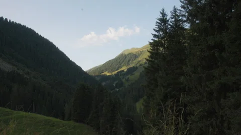 Sunshine On A Mountain Valley Peak Tracking In, Wide Shot Stock Footage 307707284