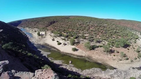 Sunshine over almost dry Murchison River bed in Kalbarri NP Stock Footage 70966704