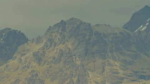 Sunshine on rocky alpine cliff Stock Footage 159750290