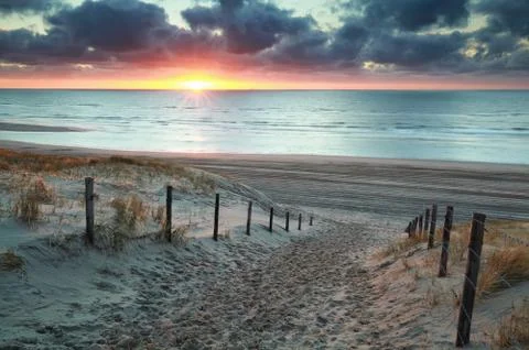 Sunshine on sand path to sand beach Stock Photos