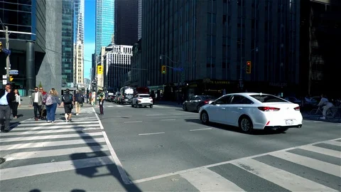 Sunshine shining down busy busy city street Video stock 118852910