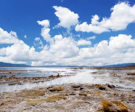 Sunshine surface covered with steam and geysers in Bolivia Stock Photos