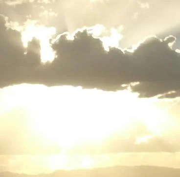 Sunshine through a cloud Stock Photos