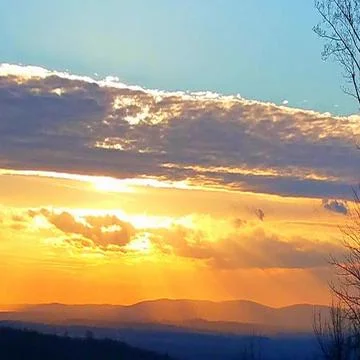 Sunshine through the clouds Stockfoto's