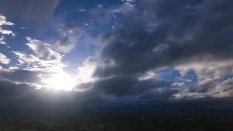 Sunshine through the dark clouds Stock Footage 139784543