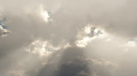 Sunshine through moving clouds Stock Footage 32361869